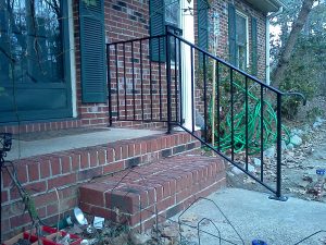 CUSTOM WROUGHT IRON HANDRAIL AND RAILING AT FRONT STEPS